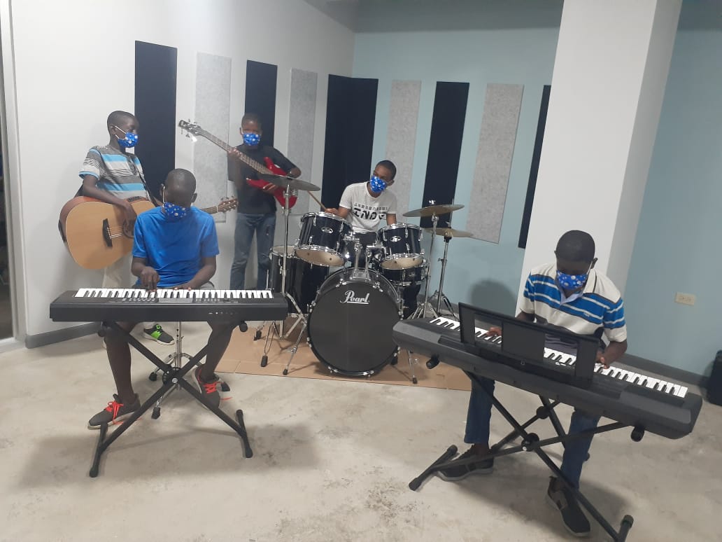 Music lessons for boys at Mount Olivet Boys Home.