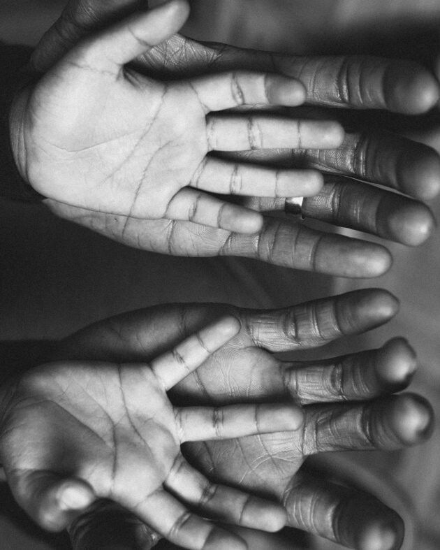 Big hands holding little hands inside of them